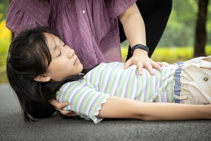 sick girl fallen on the floor