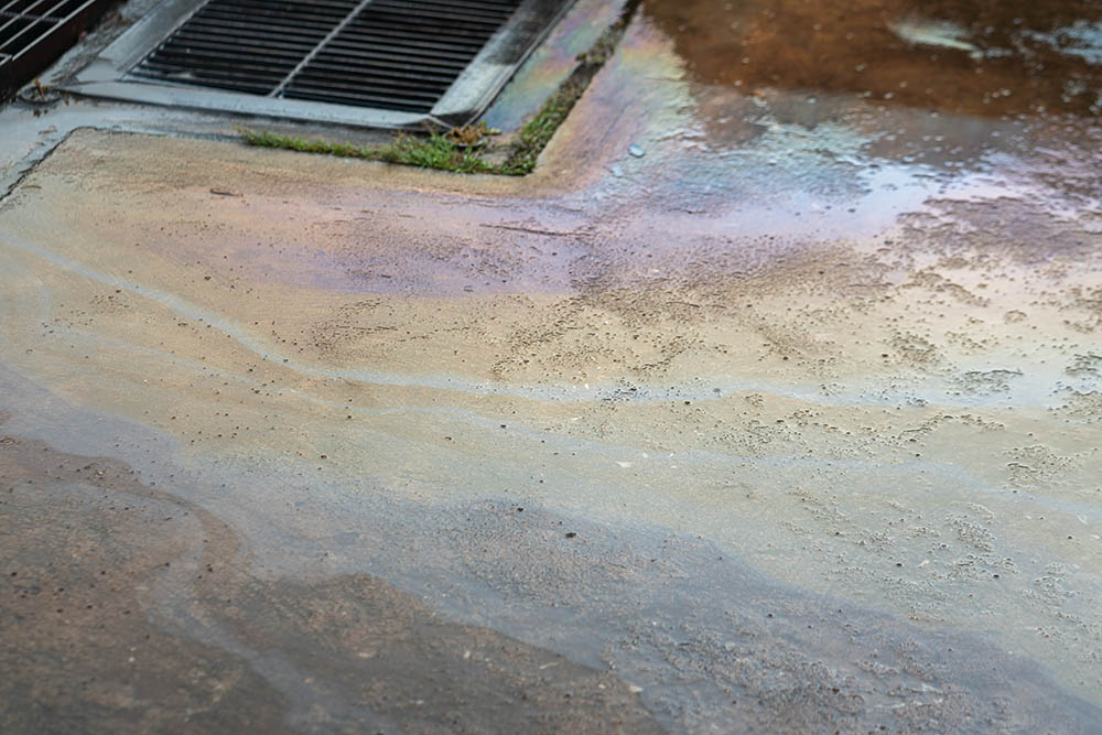 stain of motor oil on concrete ground