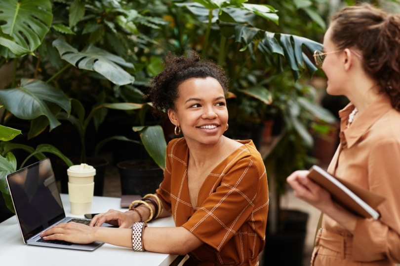 two woman in cooperative office