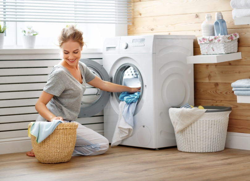 woman using washing machine