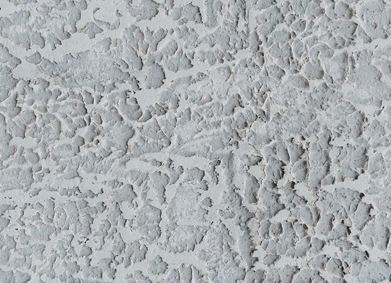 Abstract background of textured aged stucco wall