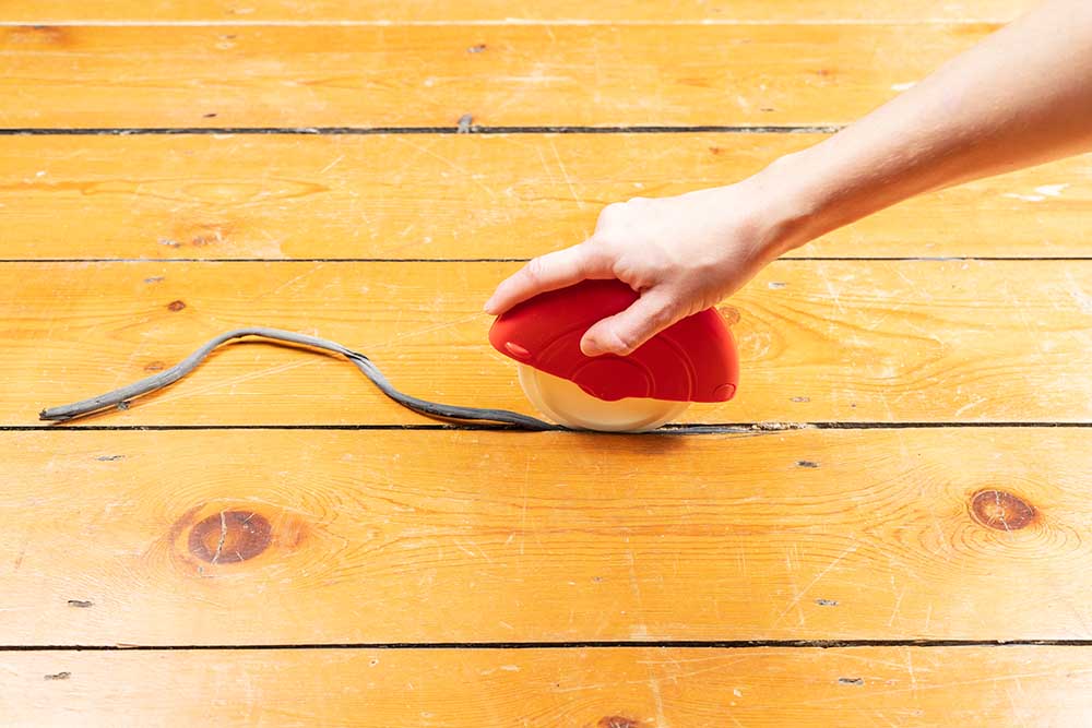 Best way to draught-proof stripped wooden floors. Using the Applicator