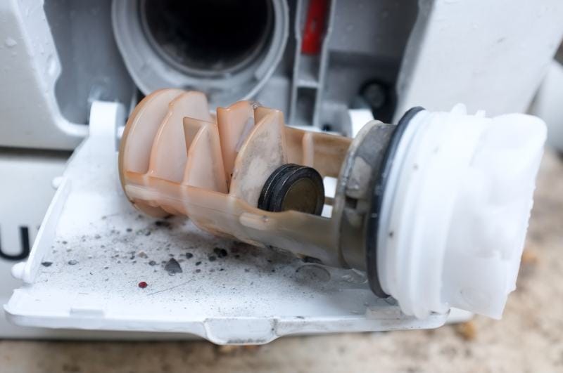Coins in washing machine's drain pump filter