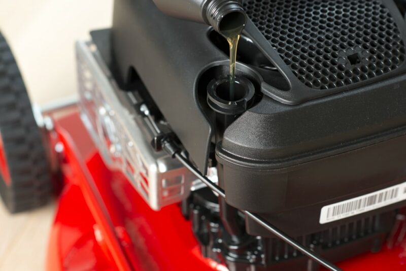 Filling oil in engine on a lawn mower
