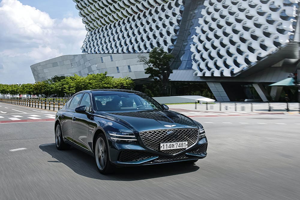 Genesis g80 driving through the city