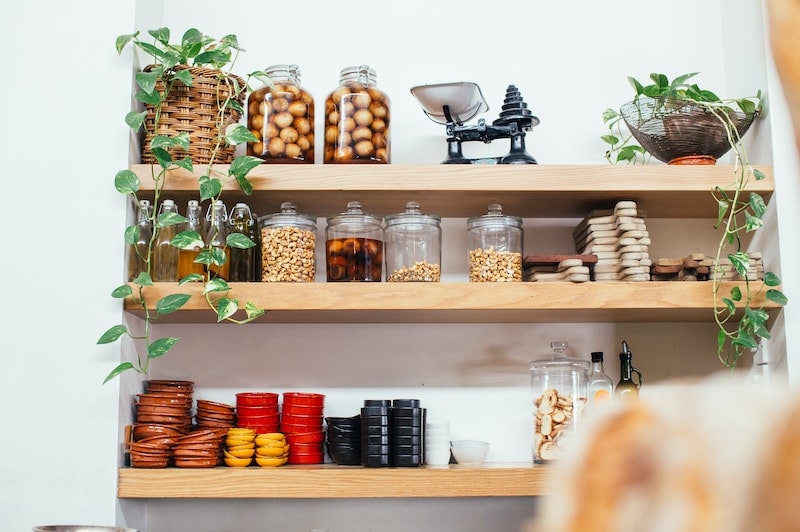 Kitchen wooden shelves with glass jars