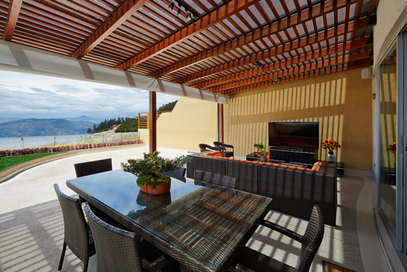 Outdoor patio with TV and dining area