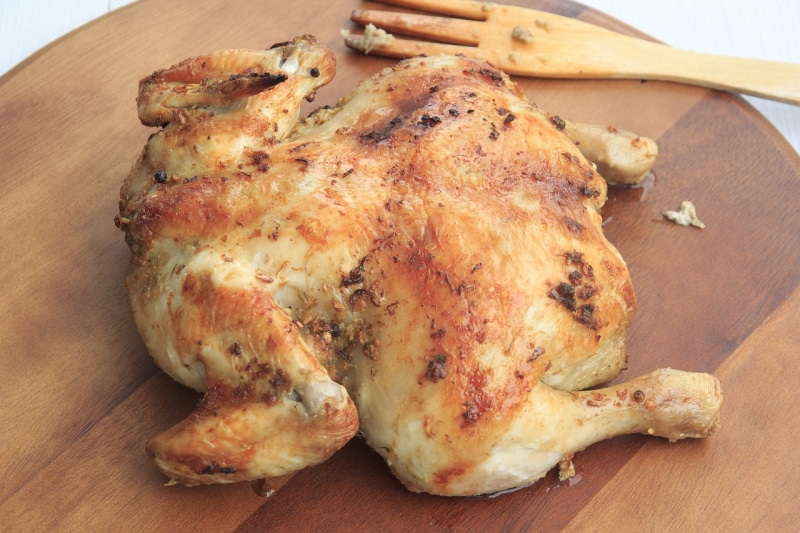 Roast chicken on a cutting board