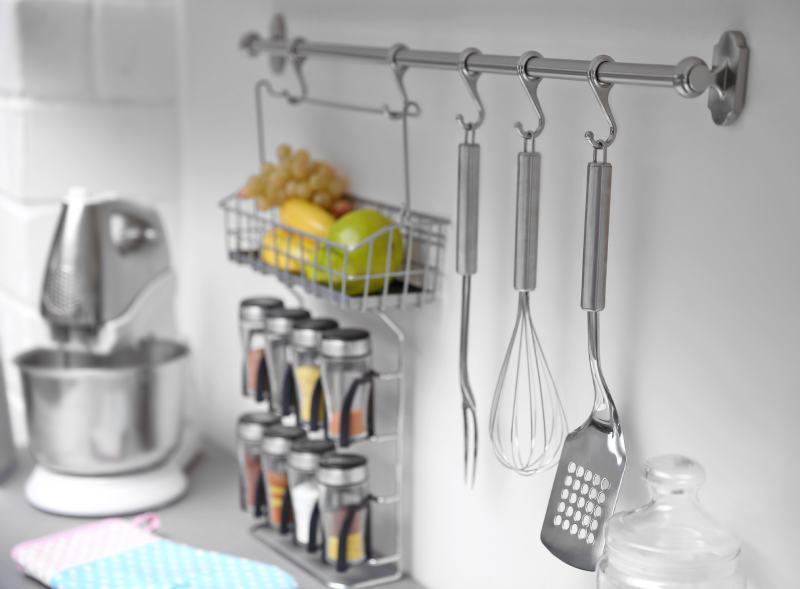 Set of cutlery hanging on wall in the kitchen