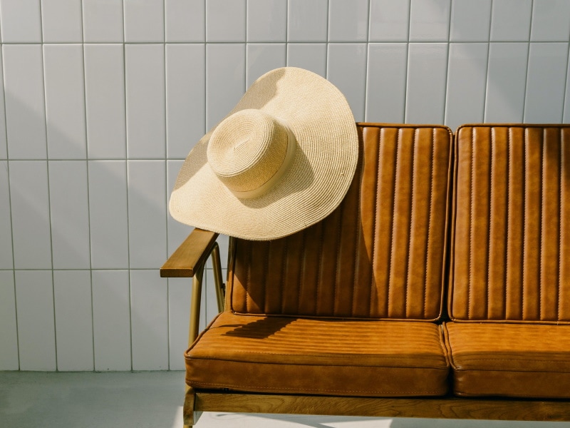 Straw hat on the back of chair