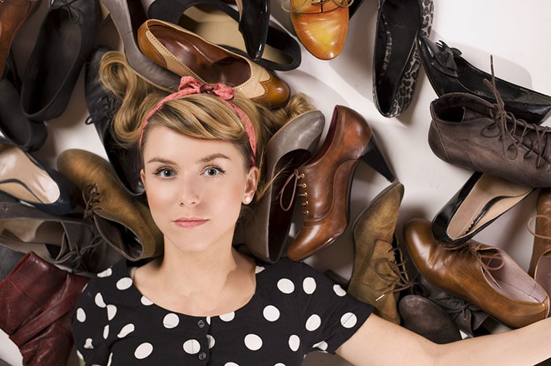 Woman with many shoes
