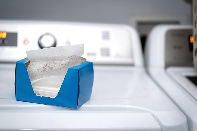 a box of dryer sheets on top of the dryer