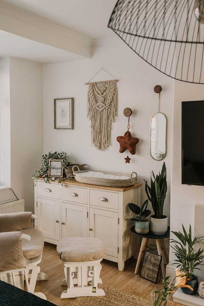 baby changing area basket above the dresser