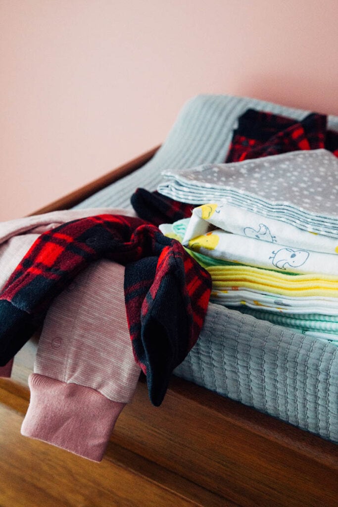 baby clothes on a bin