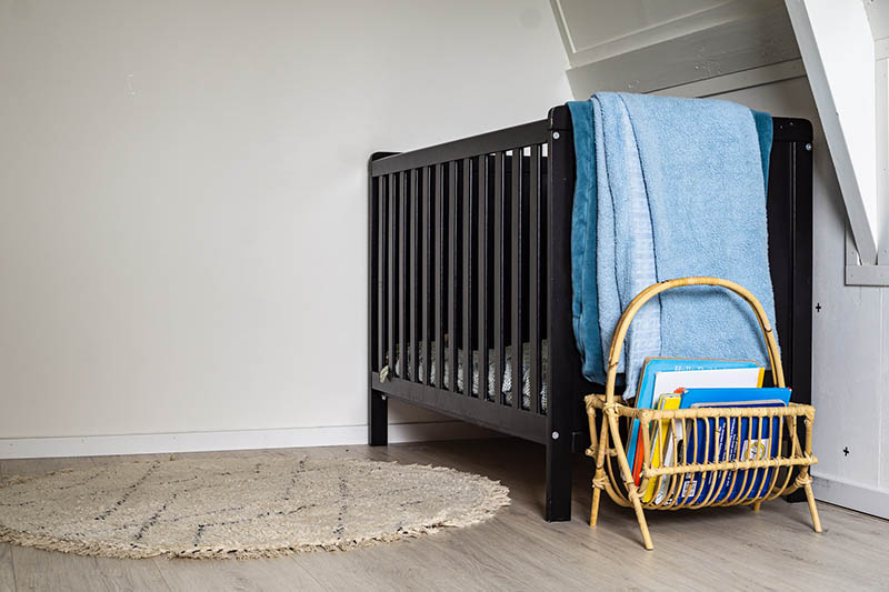 black crib in a nursery