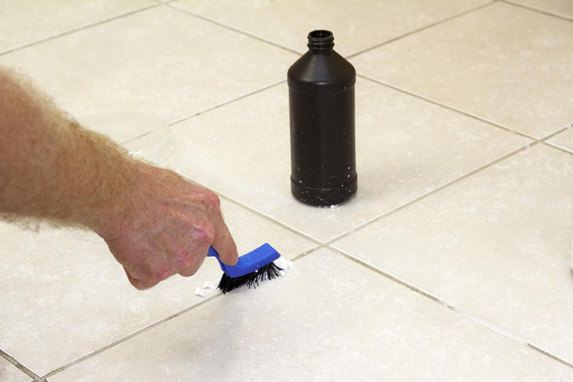 brushing tile grout with baking powder
