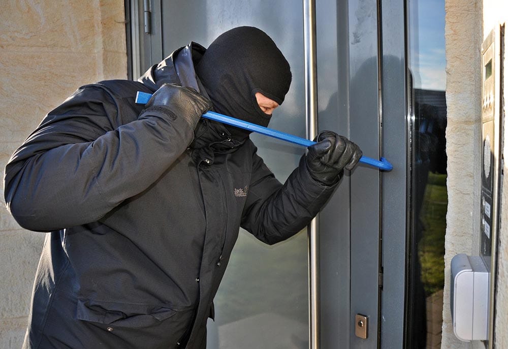 burglar trying to enter the door