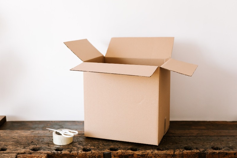 cardboard box and tape with scissors