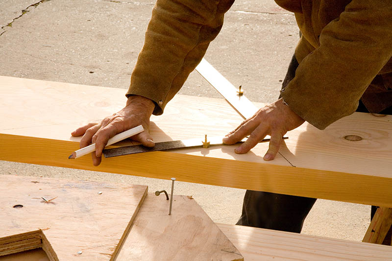 carpenter laying out stair stringer
