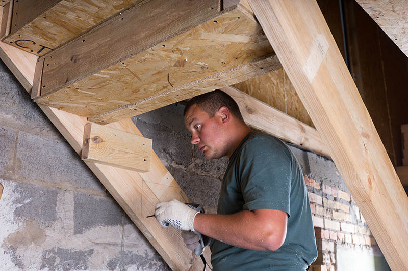 construction worker building stairs