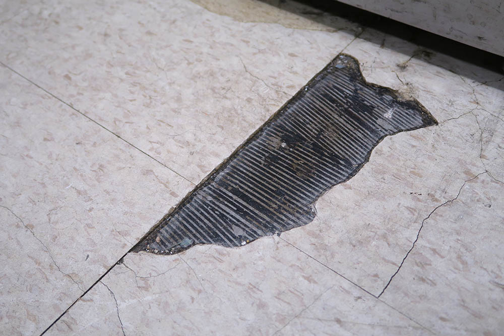 damaged peel and stick tile