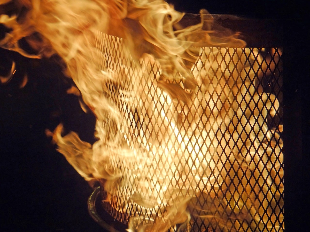 flame surges in a fire pit