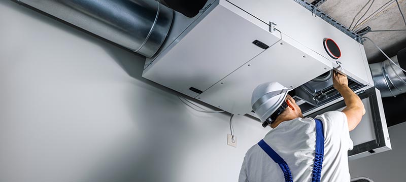 hvac engineer checking ventilation system