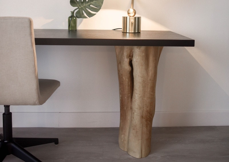 lamp on top of brown study table with natural wood legs
