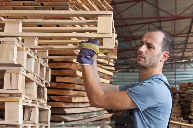 man holding pallets
