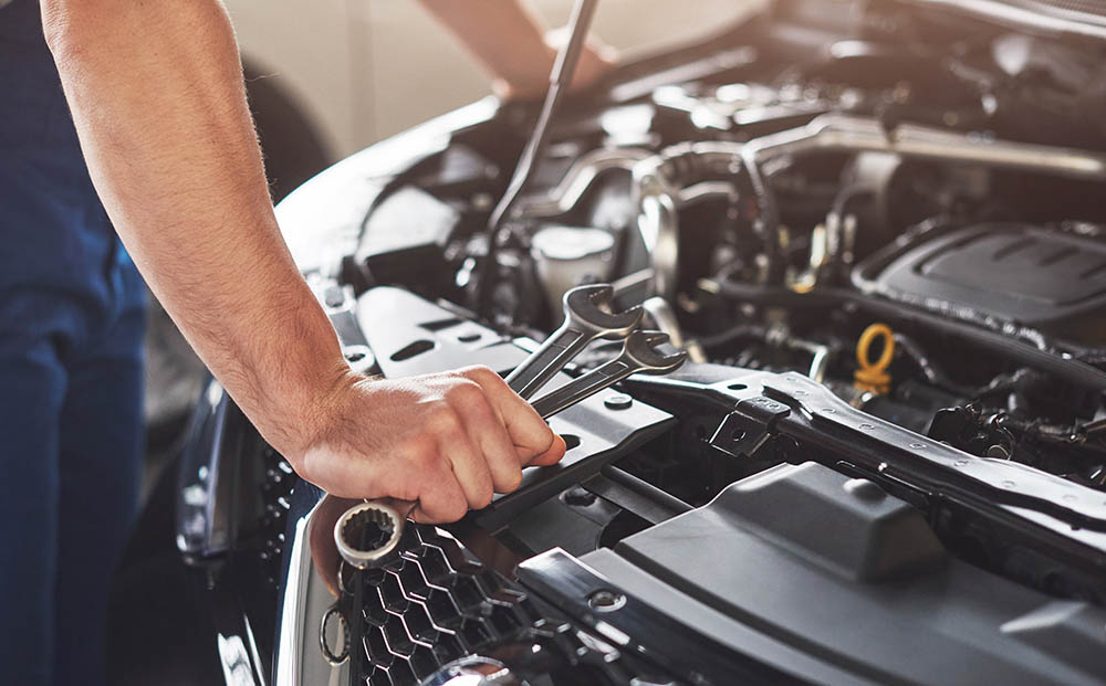 mechanic checking engine