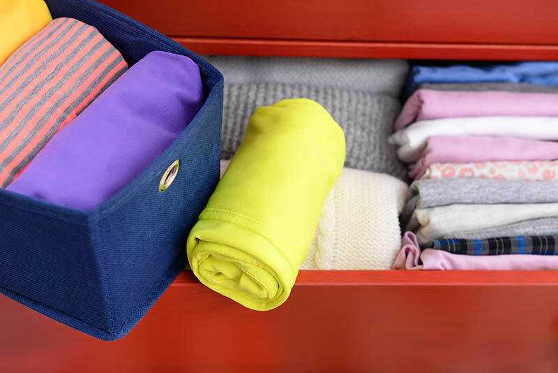 neatly rolled baby clothes
