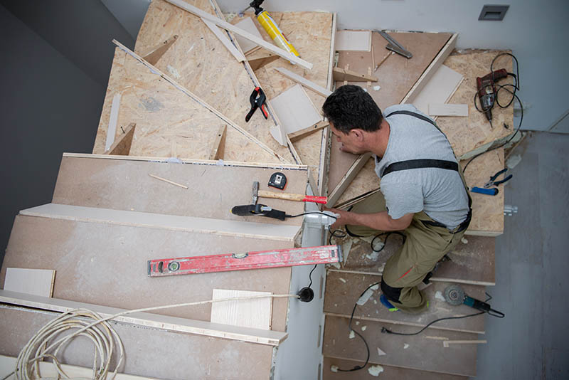 person constructing stairs
