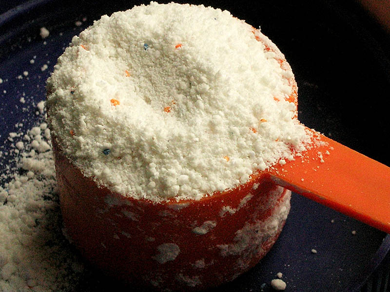 powder detergent on a spoon