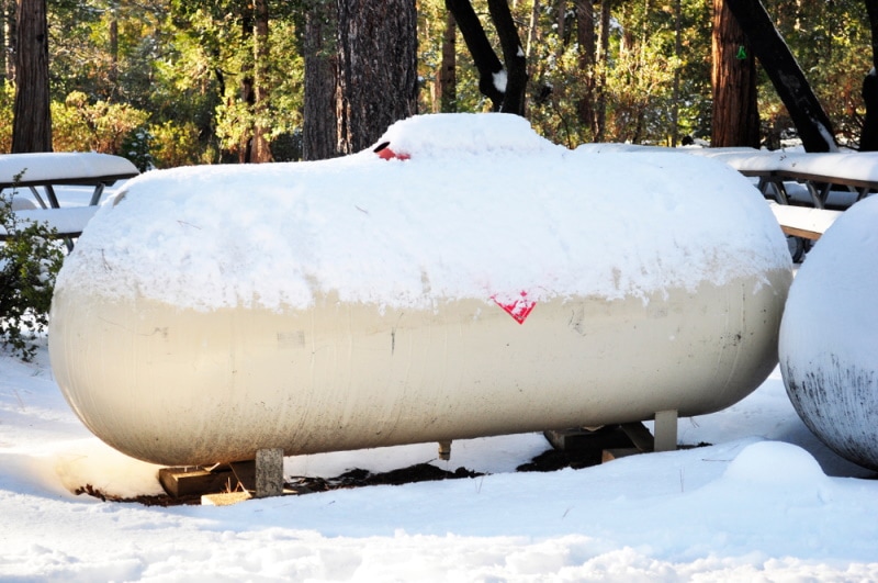 propane tank covered with snow