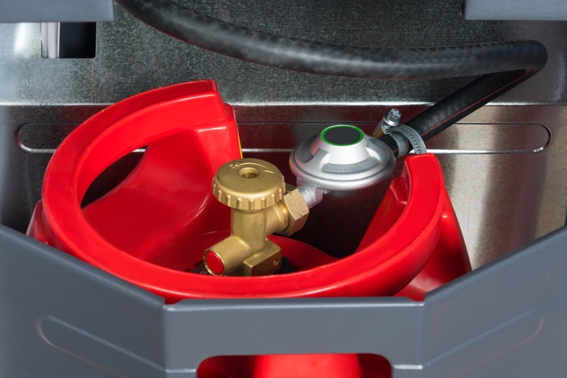 red gas tank in the heater