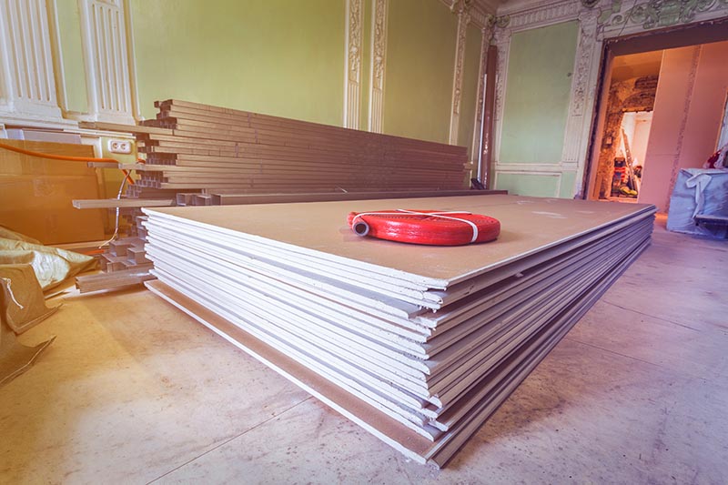 stacks of drywall in a room