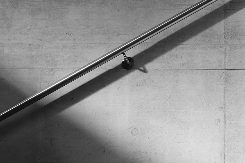 stairs handrail attached on the wall