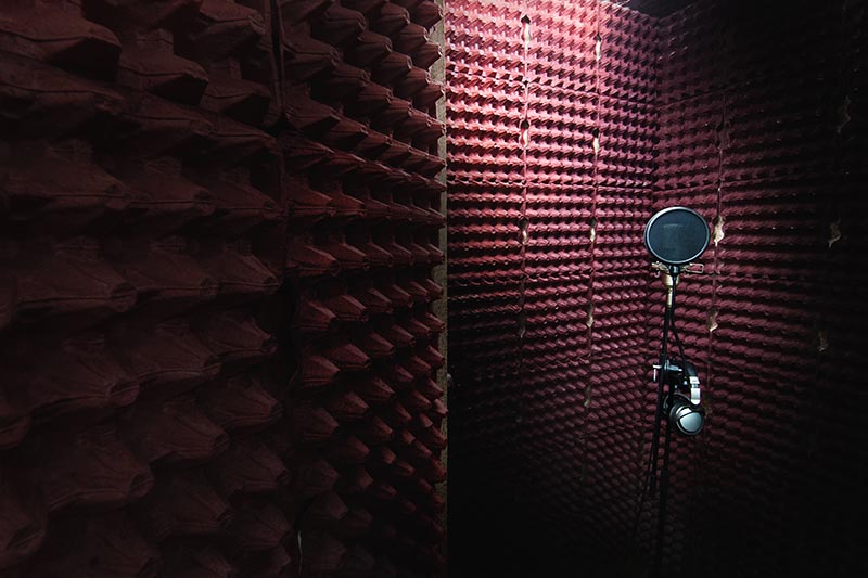 studio with egg tray cartons on the walls