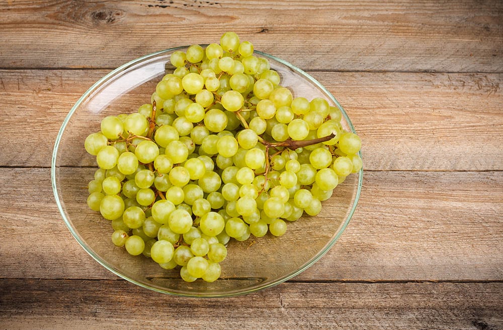 Sultana grape on a glass plate