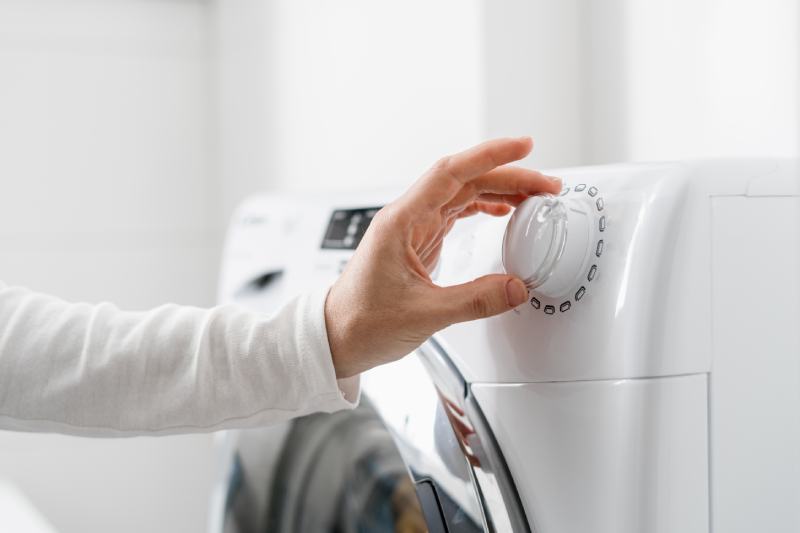 turning on the washing machine