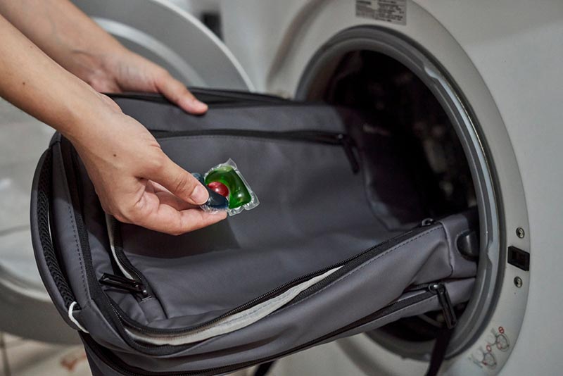 washing and cleaning backpack in washing machine