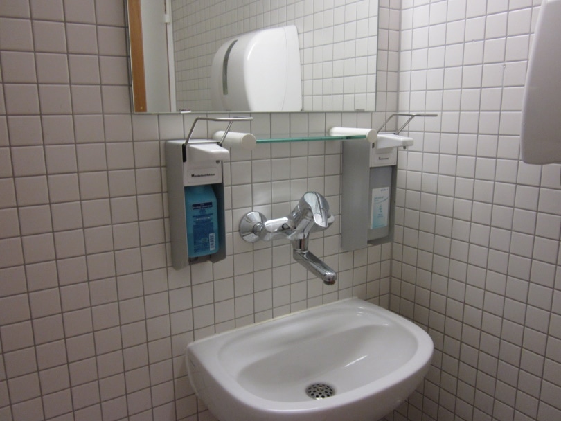 white square tiles in bath room
