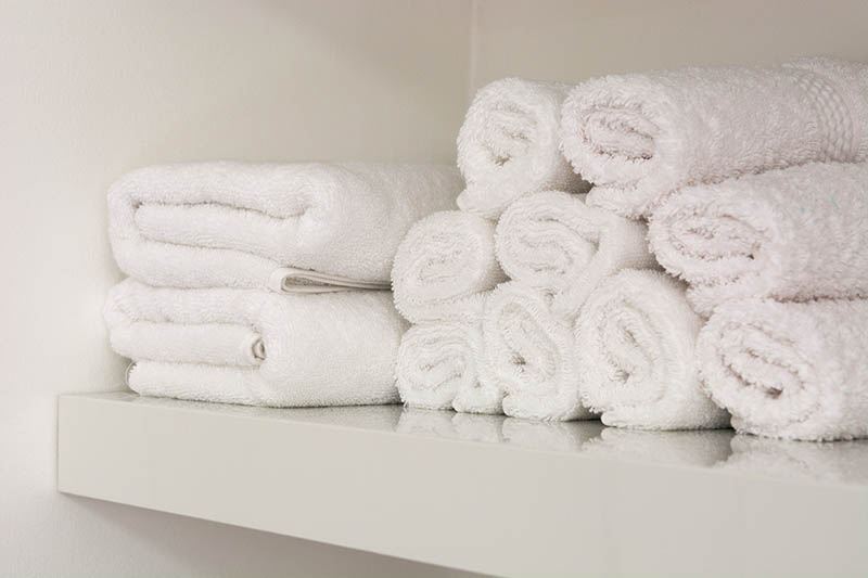 white towels on a shelf