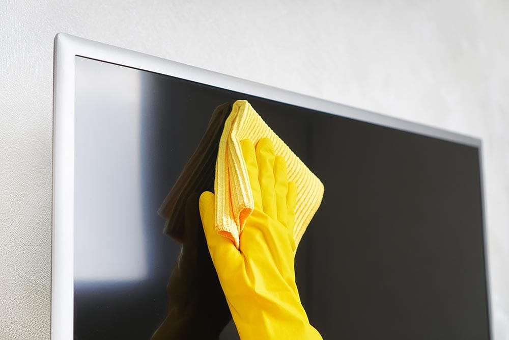 wiping off fingerprints on the TV