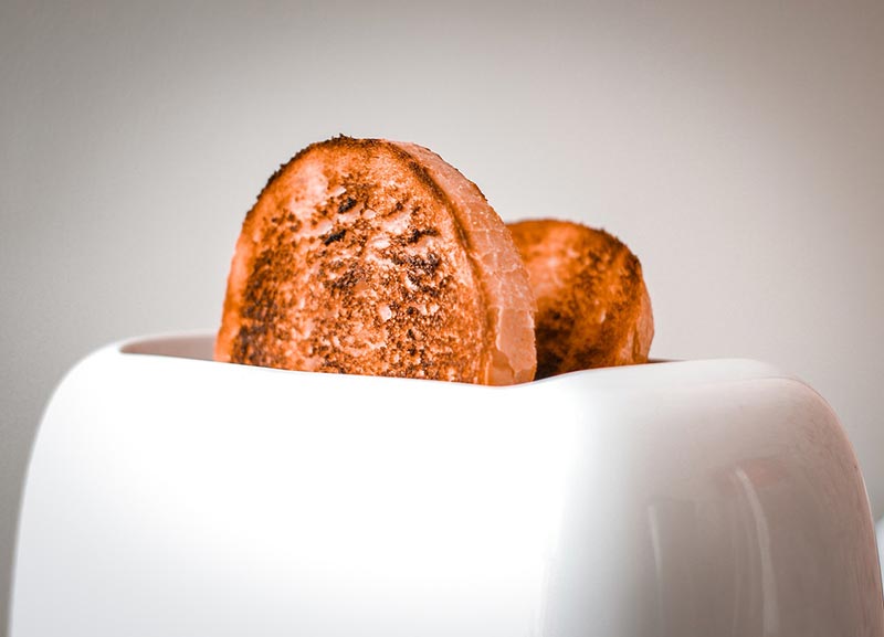 2 sliced breads in a toaster