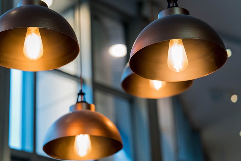 A group of hanging lights with shallow depth of field