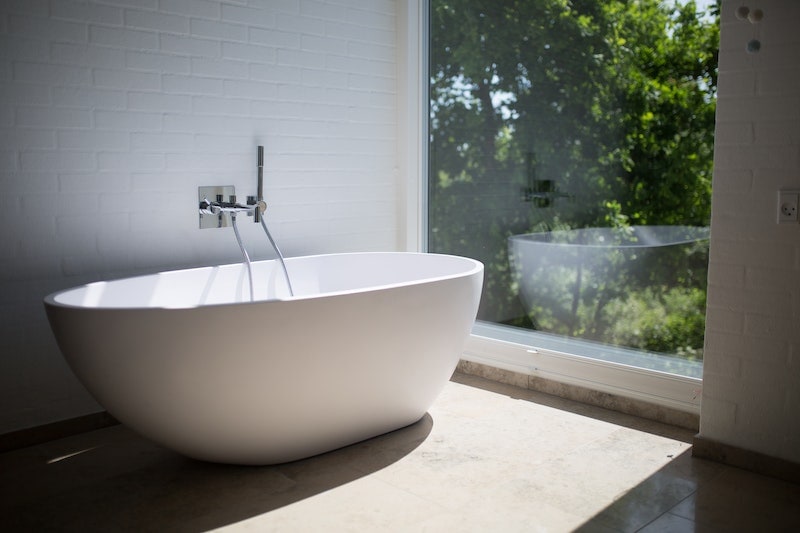 Bathtub near a window