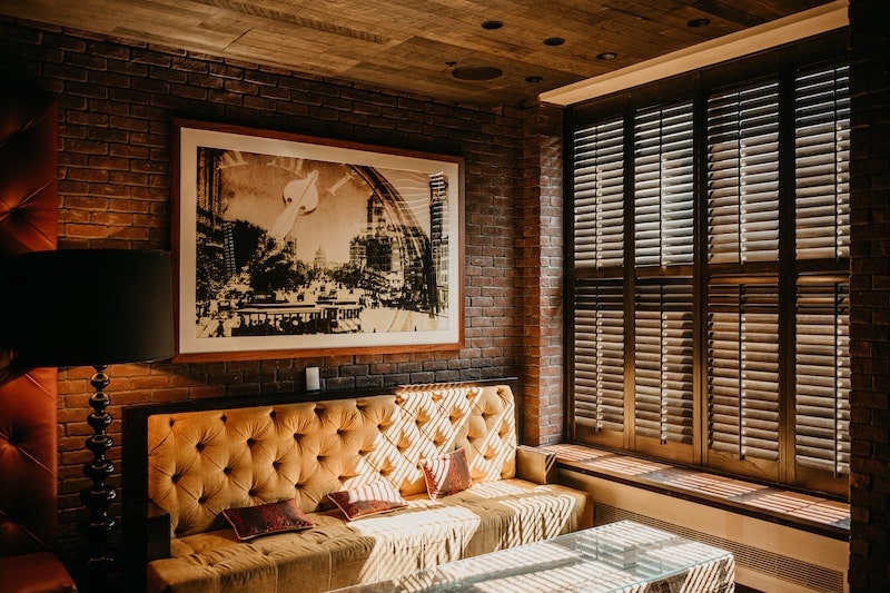 Big picture frame behind large sofa