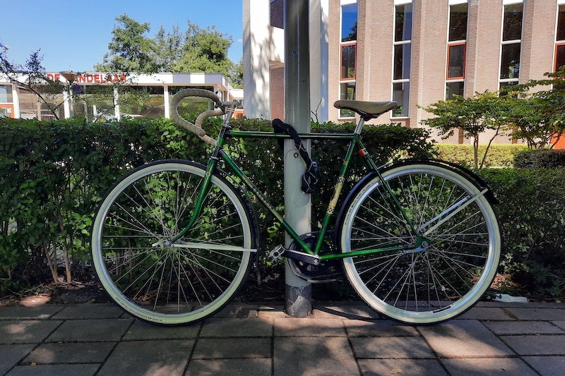 Bike locked to a street lamp post