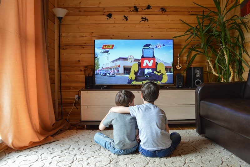 Boys watching a television